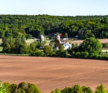 distant view of farm field and barn