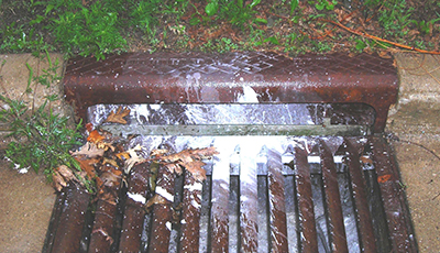 Stormdrain with white paint dried on it