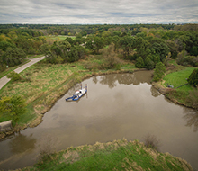 Aerial view of a dredge boat in the river