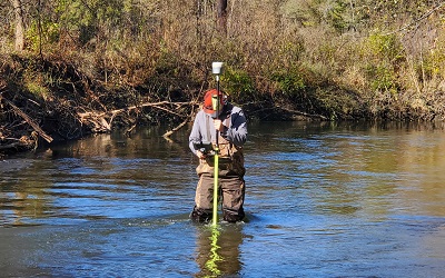 Black Earth Creek - person in stream with monitoring equipment
