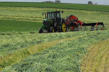 Tractor harvesting a field